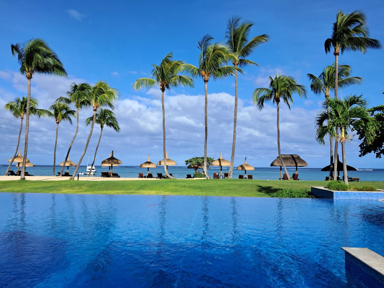 Infinity pool and palms at one of the finest properties in Mauritius, shot by us